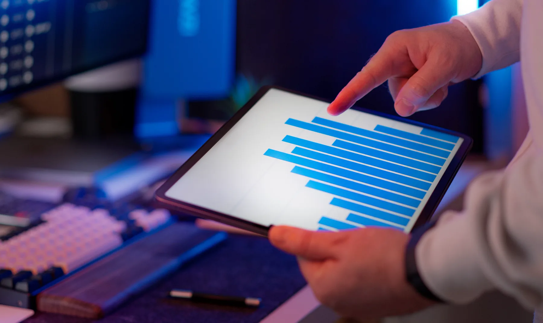 Close-up of a tablet used to review data in a technology workspace